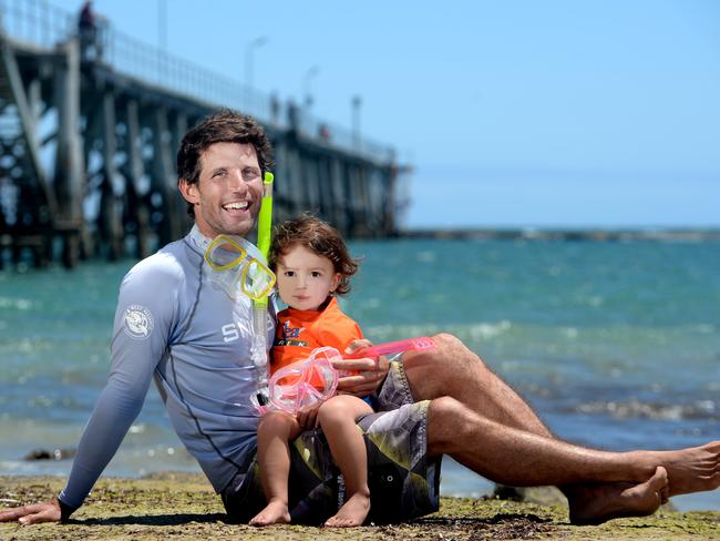 DIVE IN: Benny Walker and his son Oshan at Port Noarlunga. Picture: NOELLE BOBRIGE