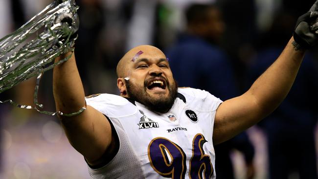 NEW ORLEANS, LA - FEBRUARY 03: Ma'ake Kemoeatu #96 of the Baltimore Ravens celebrates following their win against the San Francisco 49ers during Super Bowl XLVII at the Mercedes-Benz Superdome on February 3, 2013 in New Orleans, Louisiana. The Ravens defeated the 49ers 34-31. (Photo by Jamie Squire/Getty Images)