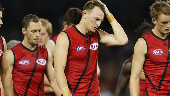 MELBOURNE, AUSTRALIA — MAY 22: Brendon Goddard of the Bombers (C) and teammates look dejected after defeat during the round nine AFL match between the St Kilda Saints and the Essendon Bombers at Etihad Stadium on May 22, 2016 in Melbourne, Australia. (Photo by Michael Dodge/Getty Images)