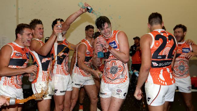 Debutant Sam Taylor gets a Gatorade shower after the win over Adelaide.