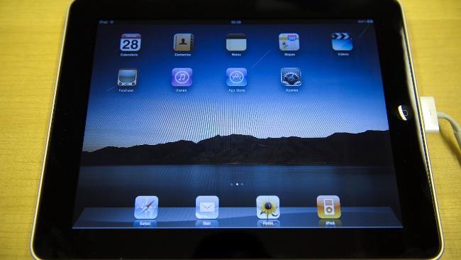 Some schools are phasing out textbooks in favour of the new iPad / AFP