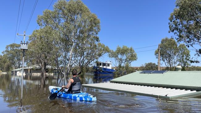 Joel Eglinton kayaks near his family’s River Murray shack at Swan Reach. Picture: Joel Eglinton