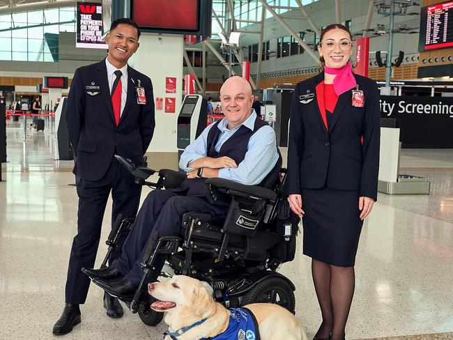 Qantas has partnered with Assistance Dogs Australia to support people with disability to fly. Photo: Qantas