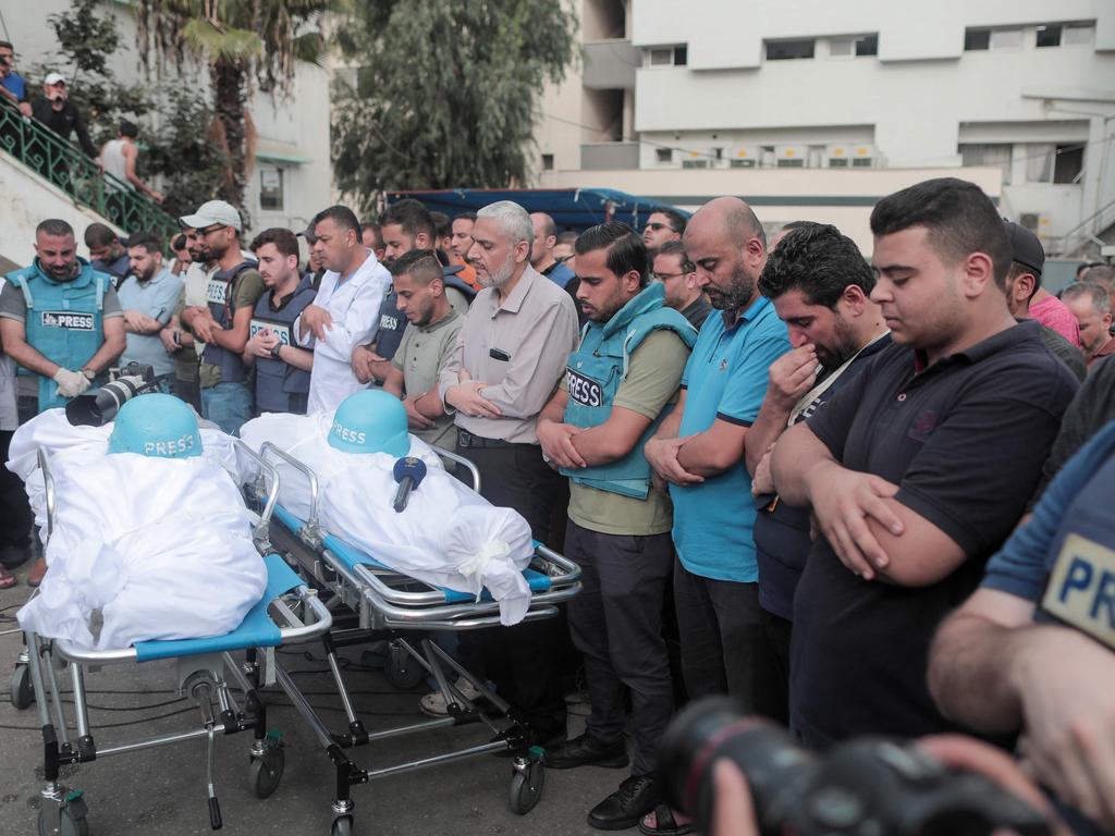 Mourners attend the funeral of fellow journalists Said al-Taweel and Mohammed Sobboh who were killed in an Israeli airstrike on Gaza City. Picture: AFP