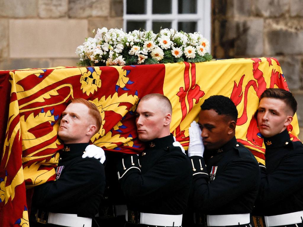 Pallbearers carry the coffin of the Queen into the Palace of Holyroodhouse in Edinburgh. Picture: AFP.