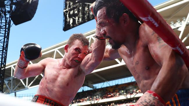 Jeff Horn punches Manny Pacquiao during their WBO World Welterweight title fight.
