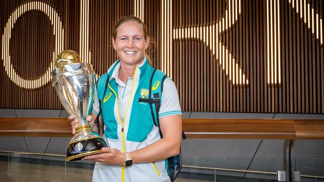 Lanning arriving home with the World Cup trophy.