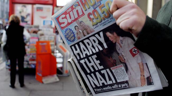 The Sun in London, 2005, reports on Prince Harry’s decision to wear a Nazi uniform to a fancy dress party. Picture: Jim Watson/AFP