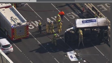 Police and firefighters swarmed the crash scene on the West Gate Bridge.