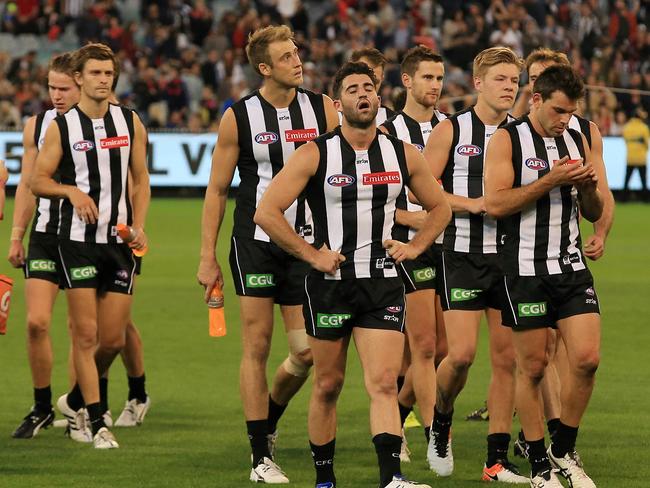 Alex Fasolo shows the pain of a third& Collingwood after the game Picture:Wayne Ludbey