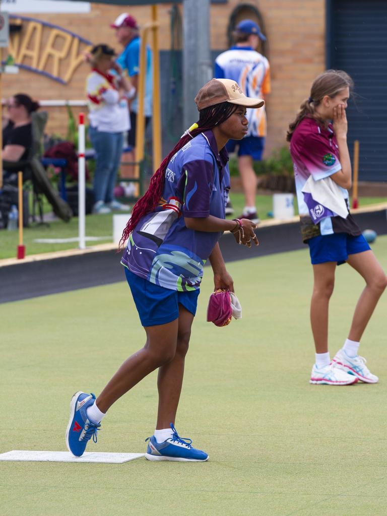 Stella Palmer of the Roma Bowls Club watches her play on the greens.