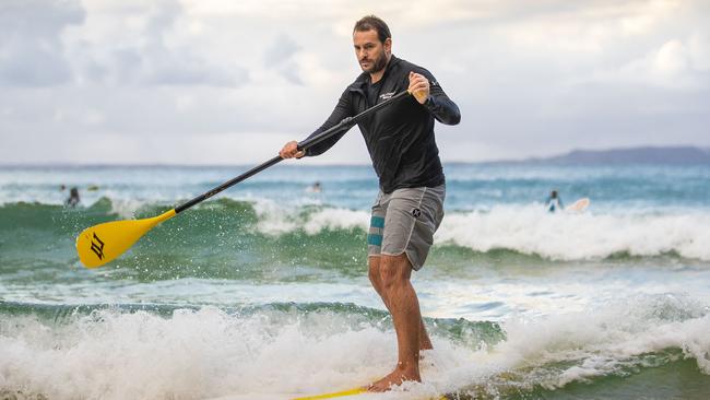 Noosa paddleboard instructor James Howard-Clarke has been hard hit by the loss of tourists since Queensland shut its borders. Picture: Glenn Hunt