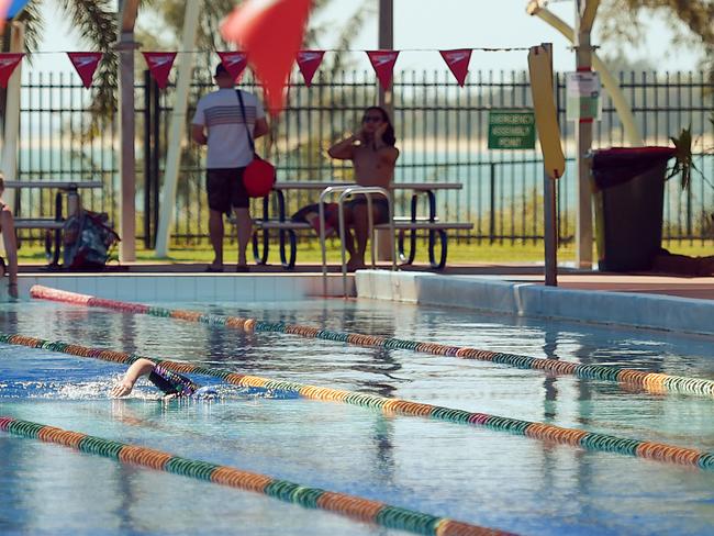 Swimmers are seen at the Nightcliff Swimming Pool in Darwin, Friday, May 1, 2020. Northern Territory becomes the first state to ease COVID-19 restrictions. (AAP Image/Patrina Malone) NO ARCHIVING