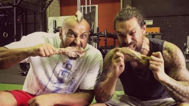 Trainer Mada Abdelhamid and Aquaman star Jason Momoa, still sporting his character’s fish-scale tattoos. Picture: Instagram.