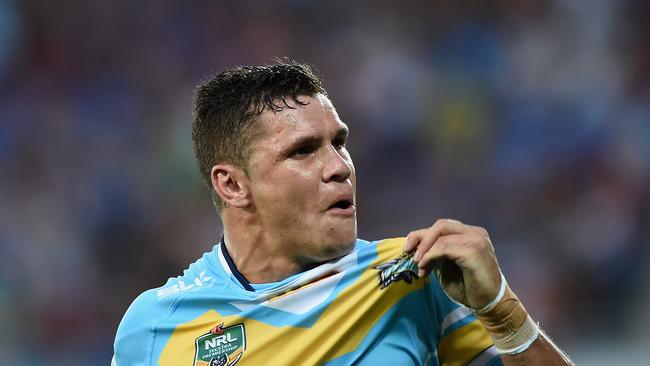 GOLD COAST, AUSTRALIA — MARCH 07: James Roberts of the Titans celebrates scoring a try during the round one NRL match between the Gold Coast Titans and the Wests Tigers at Cbus Super Stadium on March 7, 2015 on the Gold Coast, Australia. (Photo by Matt Roberts/Getty Images)