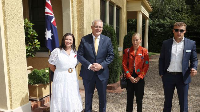 Prime Minister Scott Morrison and his wife Jenny with Grace Tame, who appeared to be uncomfortable with the meeting. Picture: Gary Ramage