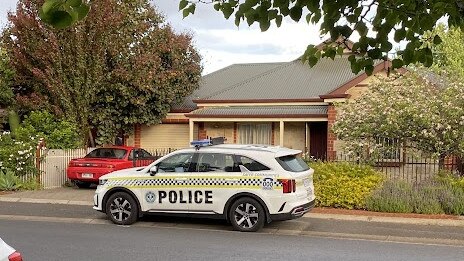 Police at the scene on Tabard Ave, Brompton, after a woman's body was discovered inside a house.