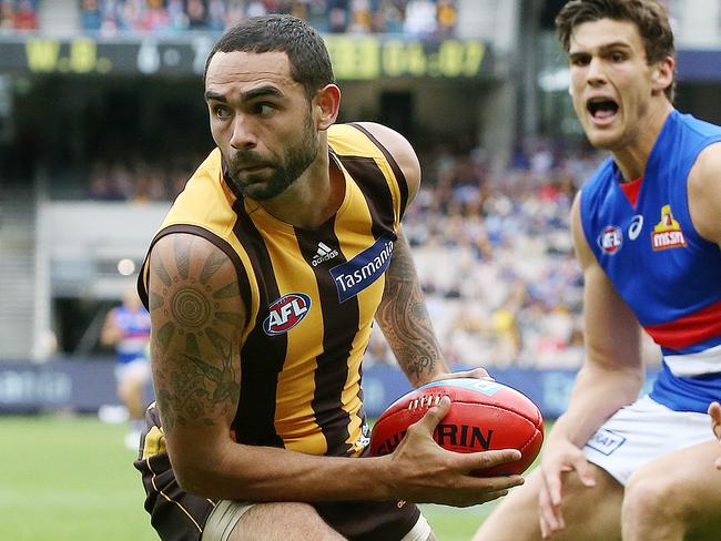 AFL. Round 3. 31/03/2019.  Hawthorn vs Western Bulldogs at the MCG.  Hawthorns Shaun Burgoyne  turns Bulldog Lewis Young  inside out    . Pic: Michael Klein.