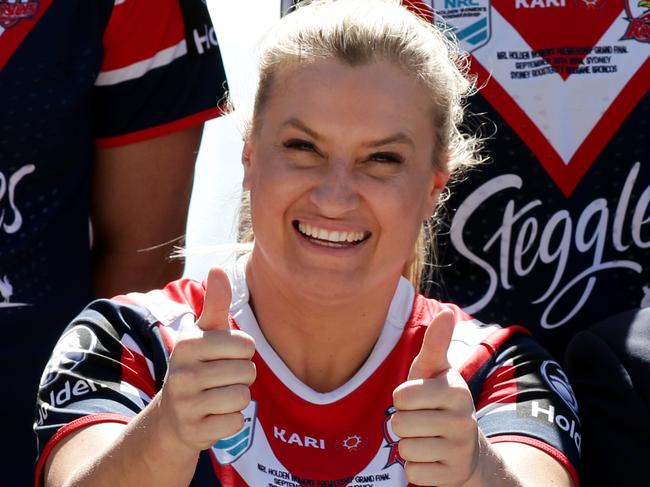 Sydney Roosters women's player Ruan Sims and coach Adam Hartigan having a laugh as they get their official team photo done at the SCG Skyline Terrace. Picture: Jonathan Ng