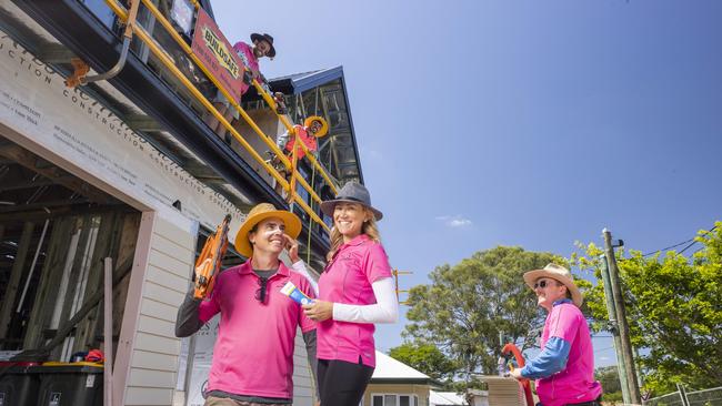 Adam and Tara Hastie practising sun safety on the worksite at Enoggera with their Activates Construction team Wade Williams, Jordan Vaughan and Joe Scannell. Picture: Lachie Millard