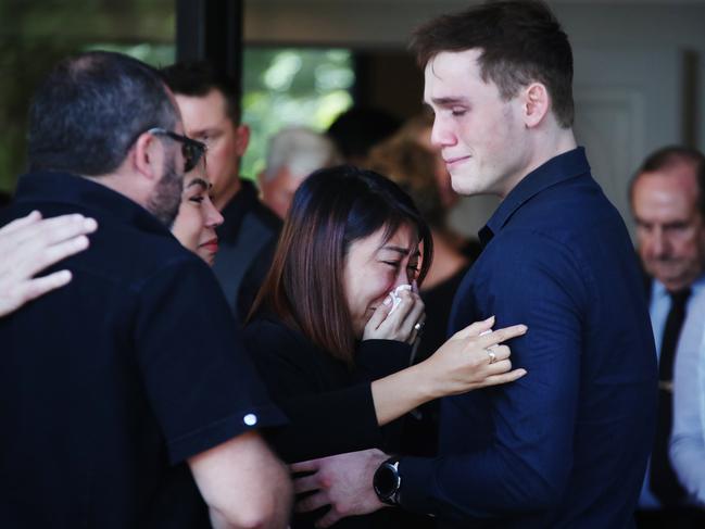 Shaun Spain’s spouse Sammi and son Joshua during his funeral service at Parkwood. Picture: Glenn Hampson.