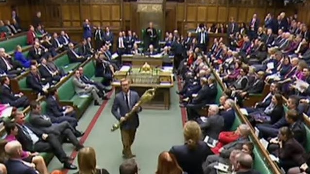 Lloyd Russell-Moyle seizes the ceremonial mace, bringing MPs to their feet in outrage. Picture. YouTube.