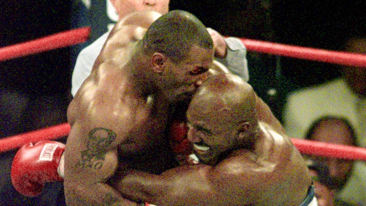 Mike Tyson (l) biting the ear of Evander Holyfield during their 1997 heavyweight bout at the MGM Grand in Las Vegas.