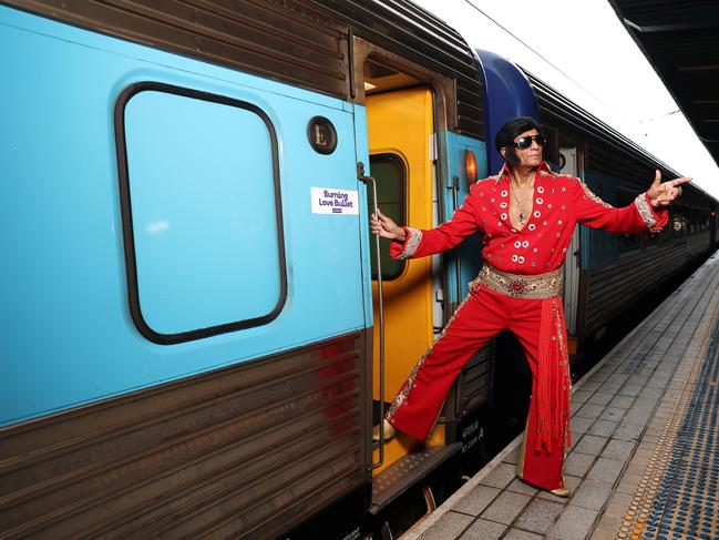 Elvis impersonator Alfred Vaz poses prior to boarding a train departing for Parkes Elvis Festival at Sydney Central Station. Picture: Don Arnold/WireImage