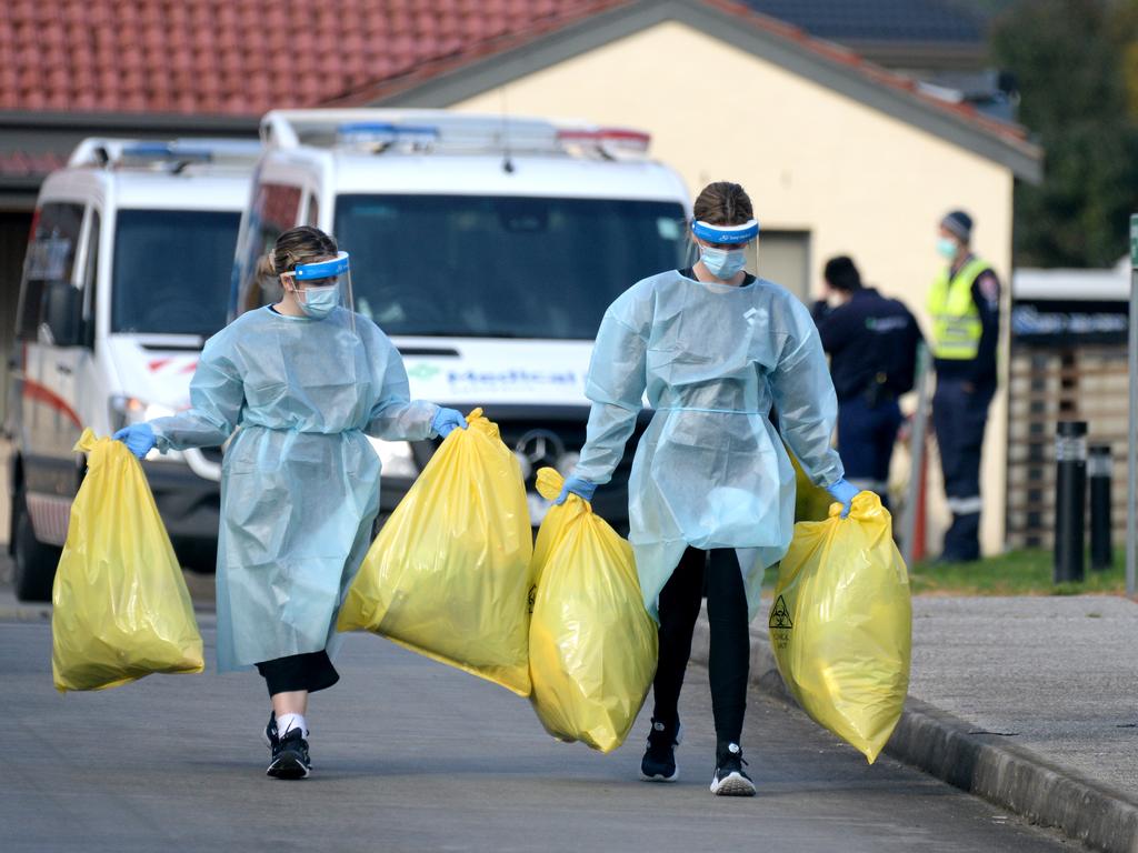 Staff remove medical waste from St Basil's Home for the Aged at Fawkner. Picture: NCA NewsWire / Andrew Henshaw