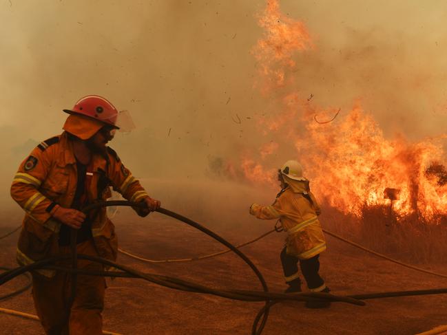 Firefighters battle a spot fire in Hillville, NSW. Picture: Getty Images