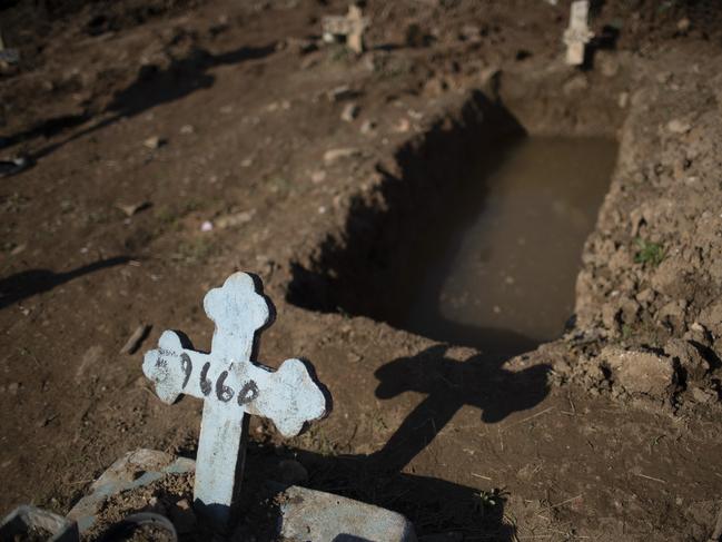 A cross with a number marks an empty grave at the Caju cemetery where many COVID-19 victims are being buried in Rio de Janeiro, Brazil. Picture: AP