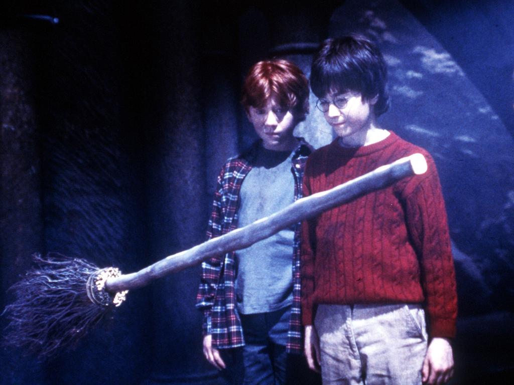 Child actors (L-R) Rupert Grint, David Radcliffe & actress Emma Watson in 2001 film "Harry Potter & The Philosophers' Stone",   Watson/Actor movies scene broomstick