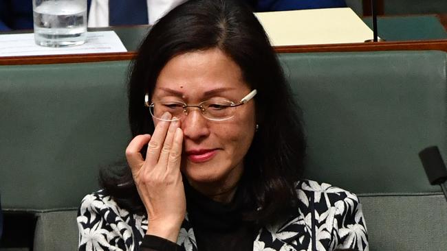 Liu wipes away tears during Question Time.