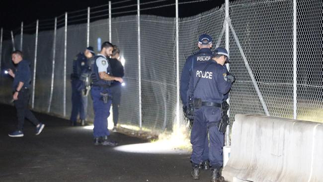 Police conduct evidence searches near the house in Riverstone where a fatal stabbing occurred Picture: Steve Tyson