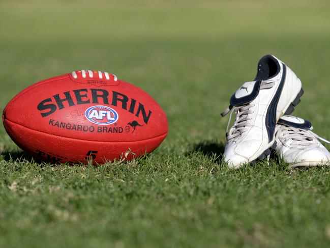 Generic AFL Sherrin football and football boots. sport /