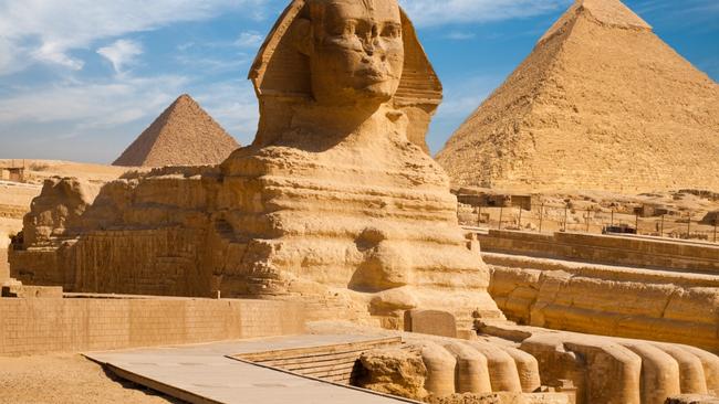 The Great Sphinx including the pyramids of Menkaure and Khafre in the background in Giza.