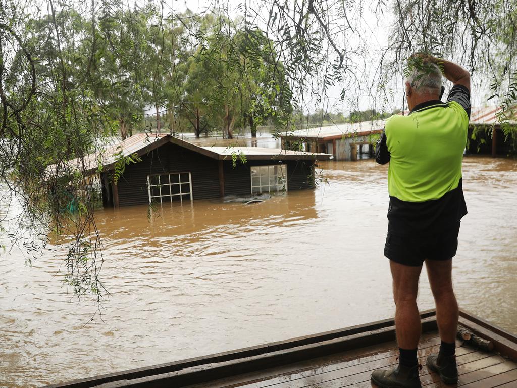 Camden a day after another flood in the area in two weeks .Phil Oliver ( cap) sevens damage on his property at 2 Exeter st Camden.