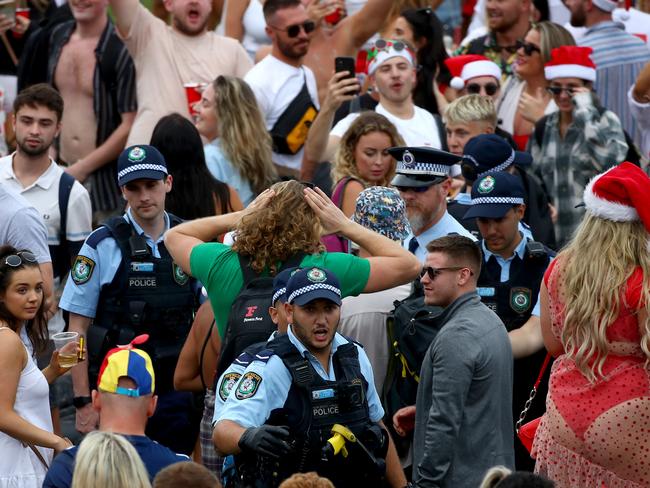 Police disperse a wild Christmas Day party on Sydney’s Bronte Beach. Picture: Toby Zerna