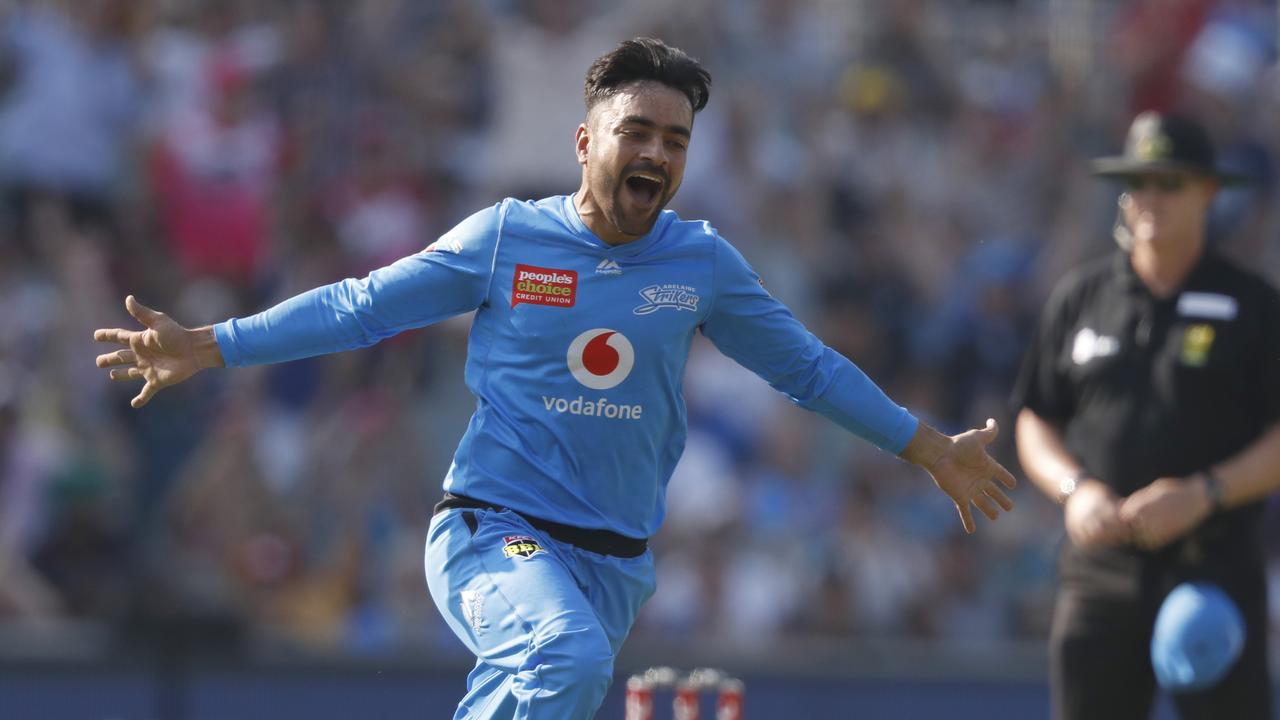 Rashid Khan wheels off in celebration after taking a wicket.