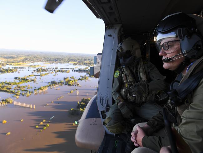 SYDNEY, AUSTRALIA - MARCH 24:  Australian Prime Minister Scott Morrison inspects damage created by floodwaters from a helicopter during a visit to flood affected areas on March 24, 2021 in Sydney, Australia. Recovery and flood clean up begins for parts of Western Sydney following days of continuous rain leading to dozens of communities declared disaster zones. (Photo by Lukas Coch - Pool/Getty Images)