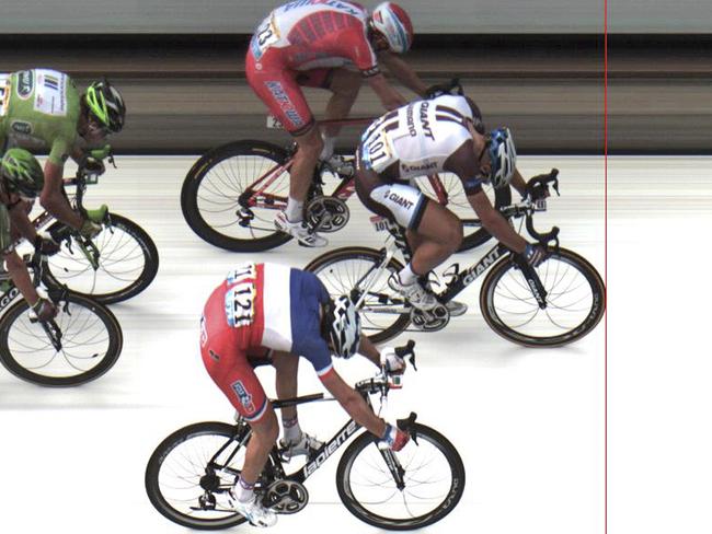 In this photo finish image released by ASO Marcel Kittel of Germany, front, crosses the finish line ahead of second place Norway's Alexander Kristoff, top, and third place France's Arnaud Demare, bottom.