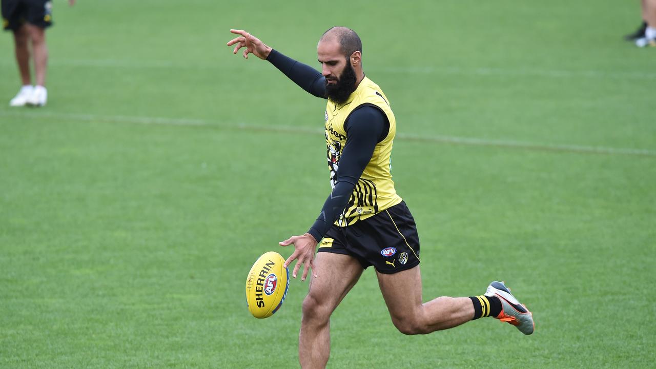 Bachar Houli kicks during a training session on Tuesday. Photo: James Ross/AAP Image. 