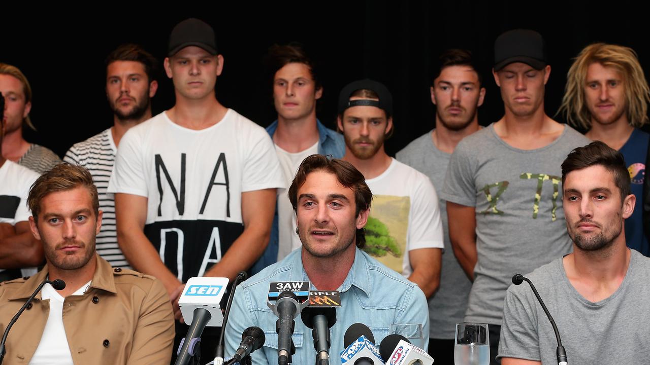 Hibberd (back right) fronts the media with his then Essendon teammates during the peptides saga.