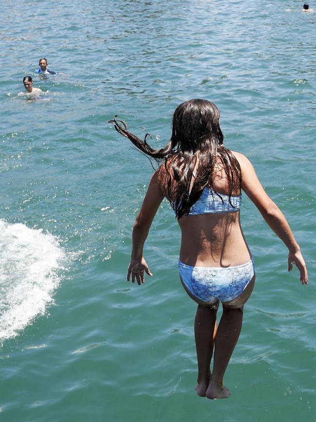 A girl cools off at Balmoral Beach on Boxing Day, ahead of a heatwave. Picture: Hanna Lassen/Getty