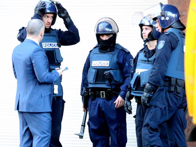 Officers during the raid in Kings Cross today. Picture: John Grainger