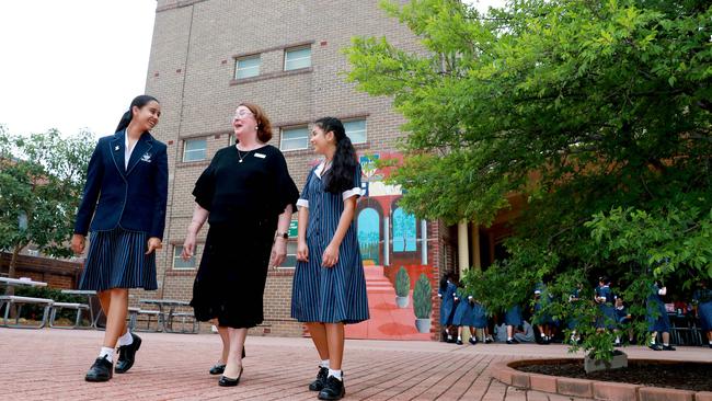 OLMC Acting Principal Marie Wood, with students Rose Parajuli and Andrea Leon Rayna, insists the school’s development project is essential. Picture: Angelo Velardo