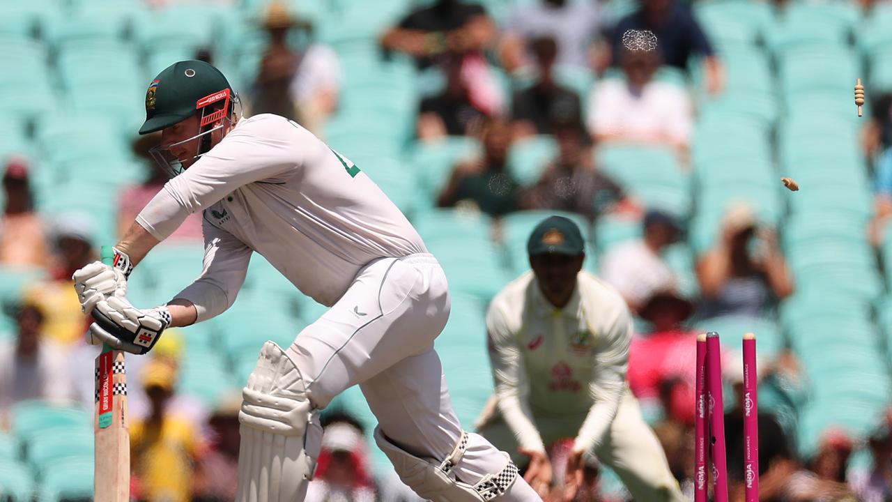 Simon Harmer is bowled out by Josh Hazlewood. Picture: Getty