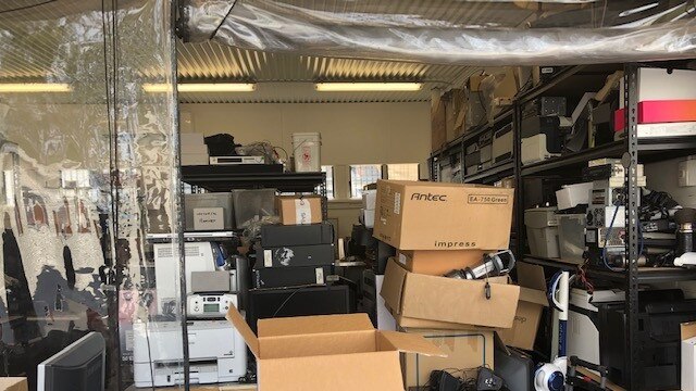 Boxes and electrical equipment is now stacked up in the workshop.