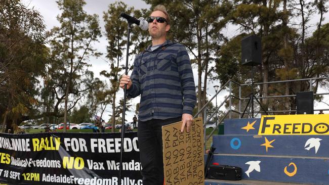 The rally was told Temple Christian College teacher Andrew Lang had been sacked after telling his students they did not have to comply with mask rules because they were not the law. Picture: Emma Brasier