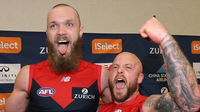 Max Gawn and Nathan Jones celebrate after singing the club song. Pic: Getty Images